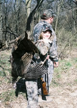 Young hunter Olivia Staab and father George Staab bring home a turkey during the youth season.
